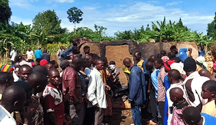 Villagers-at-charred-home-where-Pastor-Mukisa-and-family-were-burned-to-death-in-Namutumba-District-Uganda-on-Oct.-13-2024